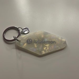 brand new lululemon diamond-shaped hotel keychain